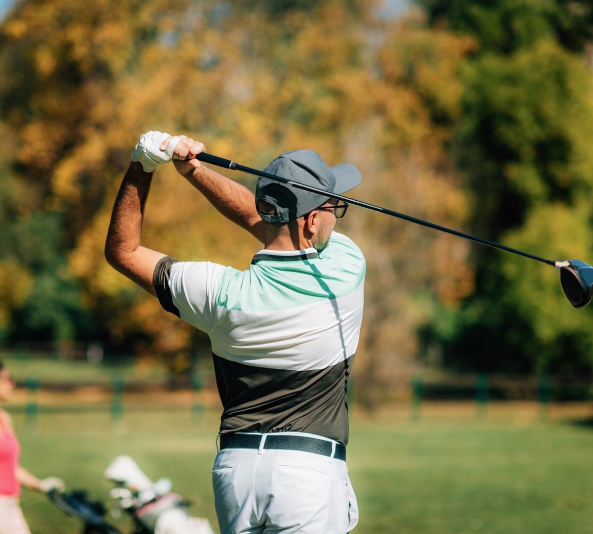 Golf couple, playing on the golf course